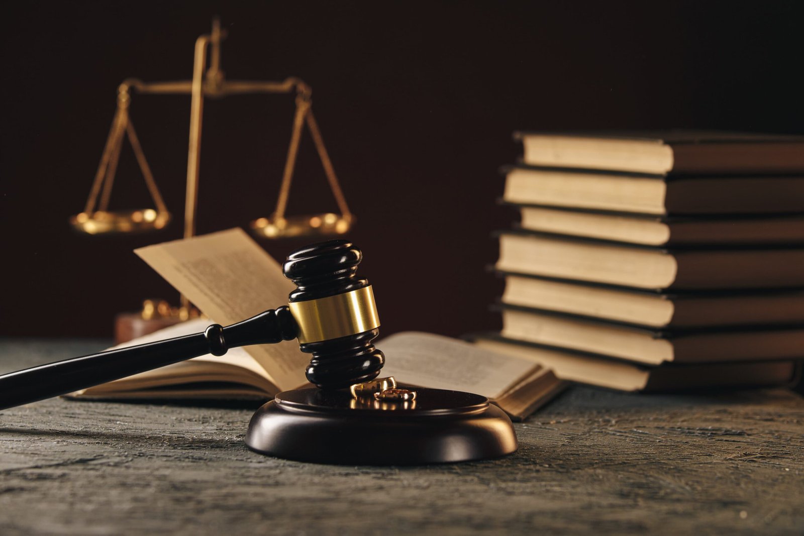 wedding-rings-figure-broken-heart-from-tree-hammer-judge-wooden-background-divorce-divorce-proceedings-min